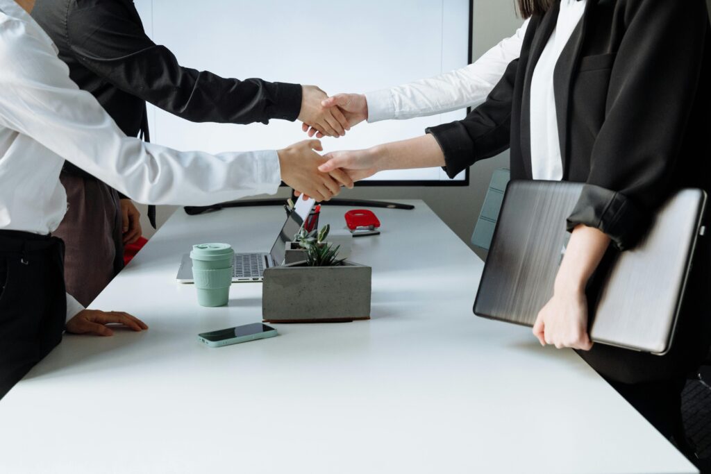 People with skills for sales jobs shaking hands