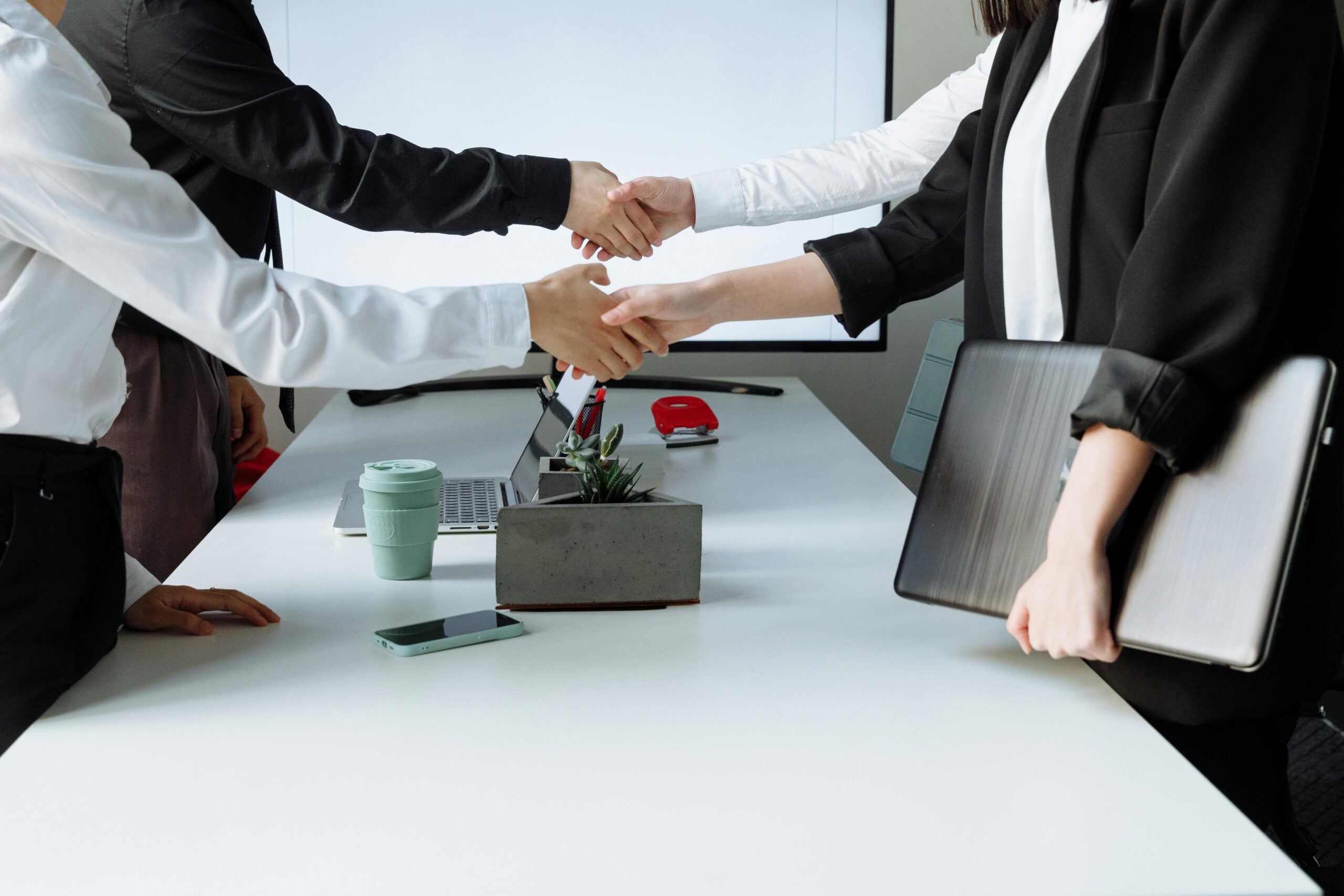 People with skills for sales jobs shaking hands