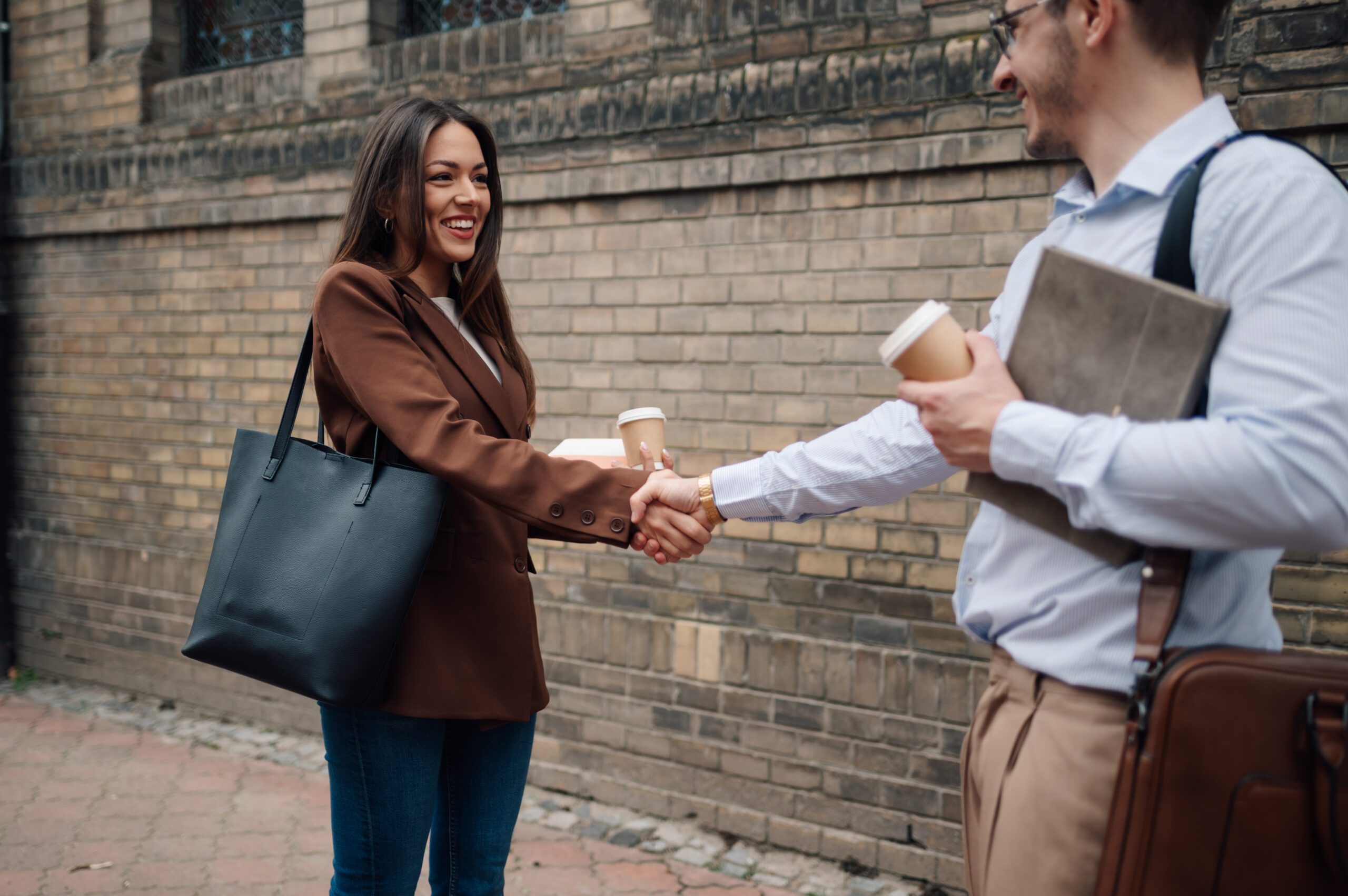 A field marketing professional shaking hands with a client