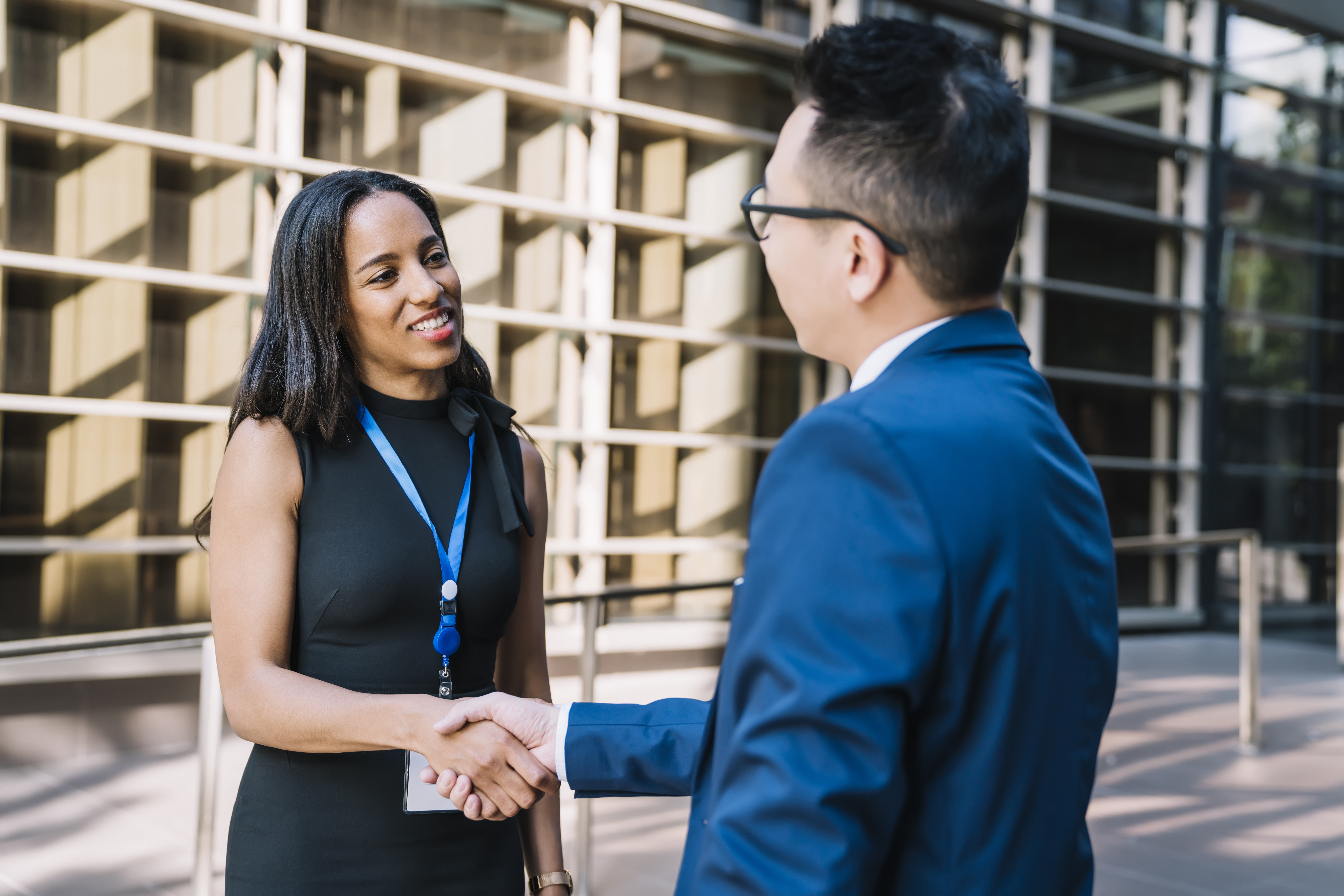 A customer acquisition strategist meeting a client outside